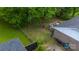 A brick house with a cozy deck, surrounded by mature shade trees at 2324 Knight Dr, Gastonia, NC 28052