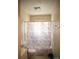 Bathroom with a patterned shower curtain and basic fixtures at 2324 Knight Dr, Gastonia, NC 28052