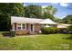 Charming brick home with a well-manicured lawn and traditional design elements at 2324 Knight Dr, Gastonia, NC 28052
