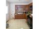 Kitchen with brown cabinets and old appliances at 2324 Knight Dr, Gastonia, NC 28052
