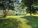 Spacious backyard with covered patio and detached garage at 2469 Elkwood Cir, Charlotte, NC 28205