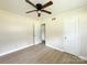A spacious, light-filled bedroom with a ceiling fan and hardwood floors at 2469 Elkwood Cir, Charlotte, NC 28205