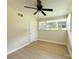 A spacious, light-filled bedroom with a ceiling fan and hardwood floors at 2469 Elkwood Cir, Charlotte, NC 28205