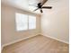 Comfortable bedroom with ceiling fan and natural light at 2469 Elkwood Cir, Charlotte, NC 28205