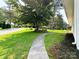 Landscaped front yard with sidewalk and mature trees at 2469 Elkwood Cir, Charlotte, NC 28205