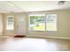 Inviting living room bathed in light from large windows by the front door at 2469 Elkwood Cir, Charlotte, NC 28205