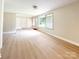 Bright and airy living area with large windows and neutral paint at 2469 Elkwood Cir, Charlotte, NC 28205