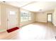 Living room featuring natural light, a front door, and neutral paint scheme at 2469 Elkwood Cir, Charlotte, NC 28205