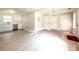 Open living area connects to a kitchen with white cabinetry, stainless appliances at 2469 Elkwood Cir, Charlotte, NC 28205