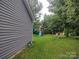 View of the backyard including a playset with a slide and swing and two chairs at 290 Greentree Dr, Rock Hill, SC 29730