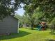 Expansive backyard featuring a swing set and trampoline, perfect for outdoor activities and Gathering fun at 290 Greentree Dr, Rock Hill, SC 29730