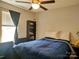 This is a simple bedroom with a ceiling fan, window, and storage shelf at 290 Greentree Dr, Rock Hill, SC 29730