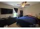 Comfortable bedroom with dark wood furnishings and a ceiling fan for temperature regulation at 290 Greentree Dr, Rock Hill, SC 29730