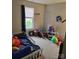 Bright bedroom with a window overlooking the outdoors and playful decor at 290 Greentree Dr, Rock Hill, SC 29730