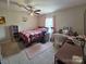 Bright bedroom with a ceiling fan, pink accents, and carpet flooring at 290 Greentree Dr, Rock Hill, SC 29730