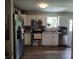 This kitchen features stainless steel appliances, white cabinets, and wood flooring at 290 Greentree Dr, Rock Hill, SC 29730
