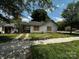 Charming single story home with carport, concrete driveway and grass yard at 306 E Arch St, Lancaster, SC 29720