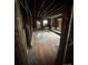 Open living room featuring exposed wood and framing ready for renovation at 306 E Arch St, Lancaster, SC 29720