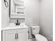 Neutral-toned bathroom with a vanity, framed mirror and a toilet at 330 Skyview Dr, Catawba, SC 29704