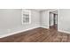 Neutral bedroom with wood-look flooring and a bright window offering natural light at 330 Skyview Dr, Catawba, SC 29704
