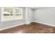 Bright bedroom with ample natural light from the window and elegant wood-look flooring at 330 Skyview Dr, Catawba, SC 29704