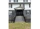 Elegant front door with decorative glass detailing, flanked by black shutters and professional landscaping at 330 Skyview Dr, Catawba, SC 29704
