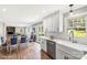 Open concept kitchen and dining area with stone fireplace and hardwood floors at 330 Skyview Dr, Catawba, SC 29704