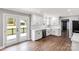 Modern kitchen with stainless appliances, white cabinets, and access to the backyard at 330 Skyview Dr, Catawba, SC 29704