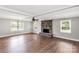 Bright living room with a stone fireplace, ceiling fan, and large windows at 330 Skyview Dr, Catawba, SC 29704