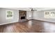 Spacious living room featuring a stone fireplace, ceiling fan, and hardwood floors at 330 Skyview Dr, Catawba, SC 29704