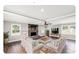 Bright living room featuring a stone fireplace, ceiling fan and hardwood floors at 330 Skyview Dr, Catawba, SC 29704