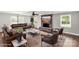 Living room featuring stone fireplace, ceiling fan, and hardwood floors at 330 Skyview Dr, Catawba, SC 29704