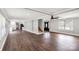 Open-concept living area with hardwood floors leading to the kitchen and front entry at 330 Skyview Dr, Catawba, SC 29704