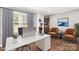 Bright and airy office space featuring a desk, comfortable seating, and built-in shelving at 330 Skyview Dr, Catawba, SC 29704