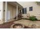 Outdoor patio featuring a fire pit, stairs to a deck and small garden at 3906 Balsam St, Indian Trail, NC 28079