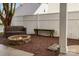 Cozy backyard with fire pit, a stone bench and a peaceful ambiance at 3906 Balsam St, Indian Trail, NC 28079