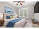 Well-lit bedroom with a large window, ceiling fan and a tastefully decorated bed at 3906 Balsam St, Indian Trail, NC 28079
