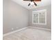 Spacious bedroom has a large window, a ceiling fan and neutral carpet at 3906 Balsam St, Indian Trail, NC 28079