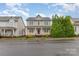 Inviting two-story home with a classic front porch and manicured bushes, perfect for curb appeal at 3906 Balsam St, Indian Trail, NC 28079