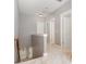 Upstairs hallway with neutral carpet leads to various rooms and staircase at 3906 Balsam St, Indian Trail, NC 28079