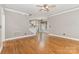 Spacious living area with hardwood floors leading into the kitchen area at 3906 Balsam St, Indian Trail, NC 28079