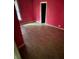 Bedroom showcasing red walls, a window, and laminate flooring at 415 Orange St, Shelby, NC 28150