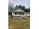 Charming home featuring a cozy front porch and a well-maintained lawn at 415 Orange St, Shelby, NC 28150