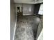 View of the living room with a ceiling fan and tile flooring at 415 Orange St, Shelby, NC 28150