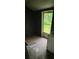 Small room with concrete flooring and access to the backyard at 415 Orange St, Shelby, NC 28150
