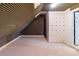 Finished attic with angled ceilings and carpet flooring, offering flexible space at 416 E Park Ave, Charlotte, NC 28203