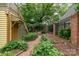 Charming backyard brick path and lush greenery, creating a private retreat at 416 E Park Ave, Charlotte, NC 28203
