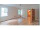 Spacious bedroom filled with natural light from the windows and featuring hardwood floors at 416 E Park Ave, Charlotte, NC 28203