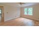 Bright, empty bedroom featuring hardwood floors and large windows offering ample natural light at 416 E Park Ave, Charlotte, NC 28203