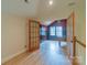 Bright bonus room with french doors and hardwood floors, perfect for home office or playroom at 416 E Park Ave, Charlotte, NC 28203